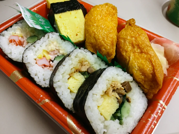 several different types of sushi sit in a plate