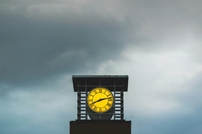 a large clock tower against a cloudy sky