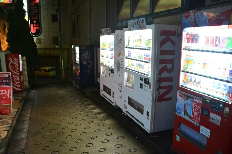 some vending machines that are lined up on the street