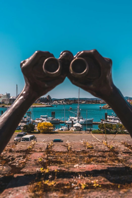 there is a sculpture of two hands forming a pair of scissors