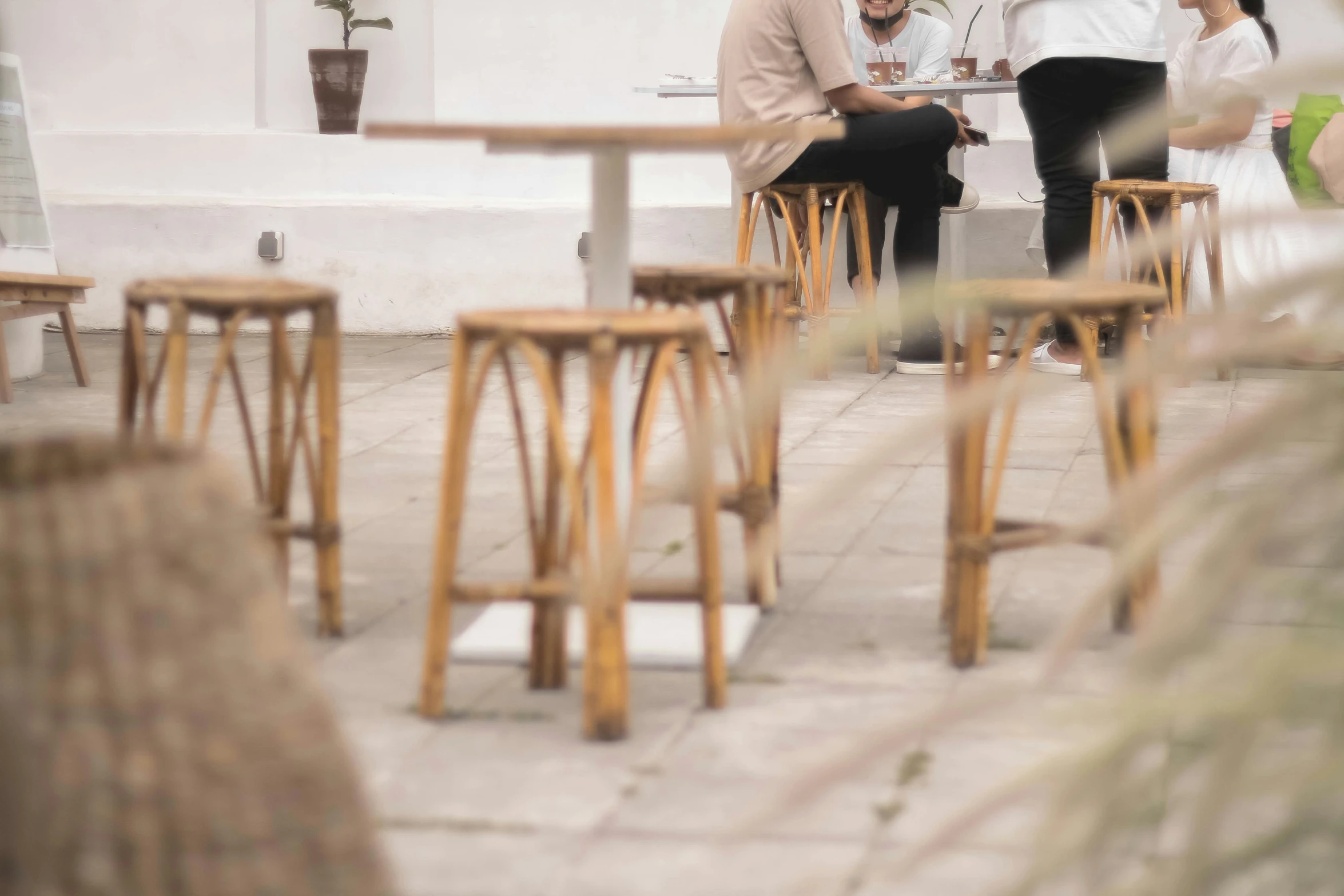 a couple of people sit down at tables