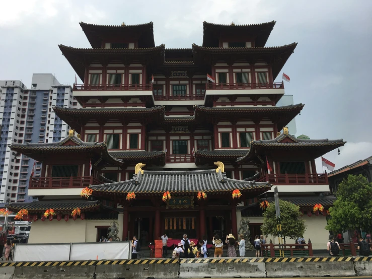 a chinese building that is red, white and orange