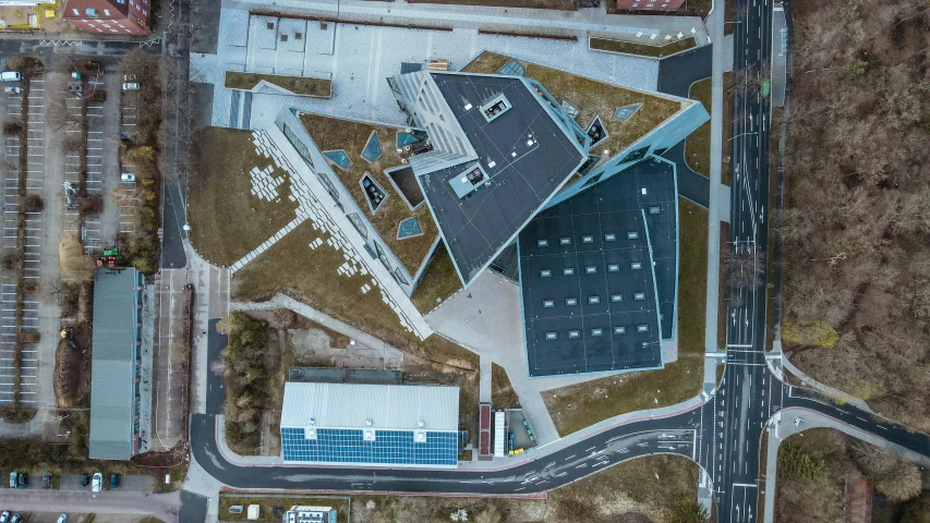 an aerial s of some buildings in the middle of a road