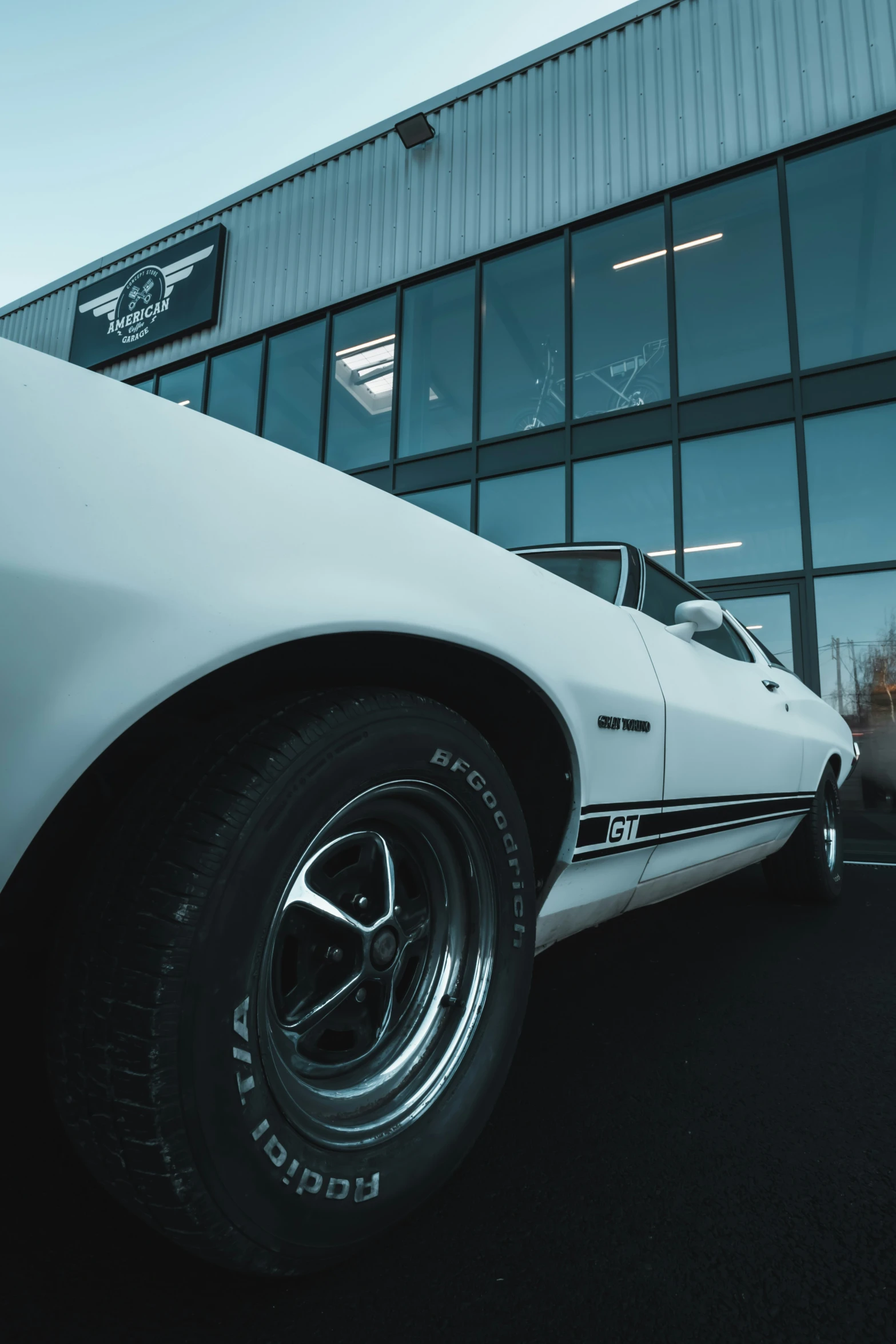 a white chevrolet z02 car parked outside of a building