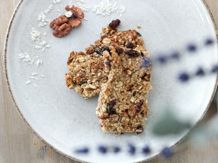 a healthy granola bar sitting on top of a white plate
