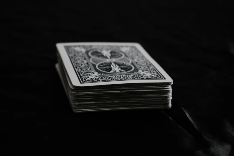 several playing cards are stacked on top of each other