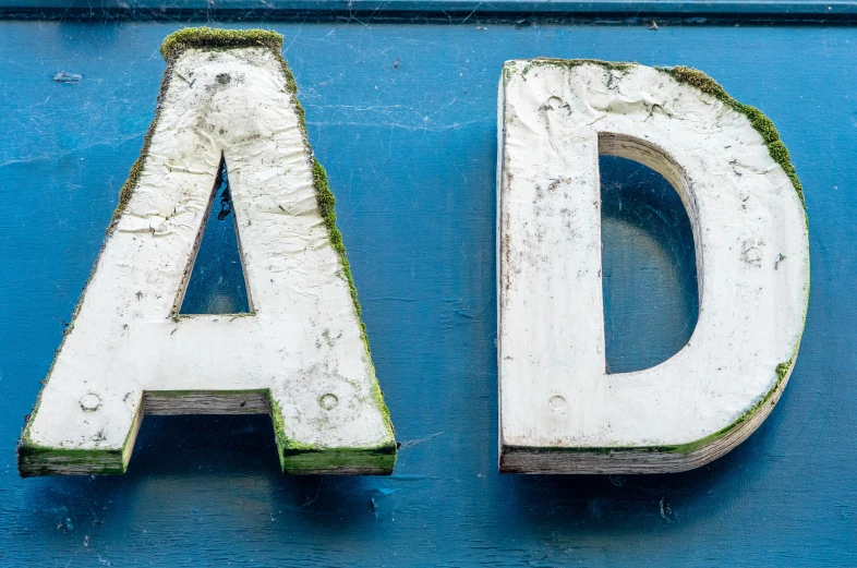 the letters d and d are made out of wood