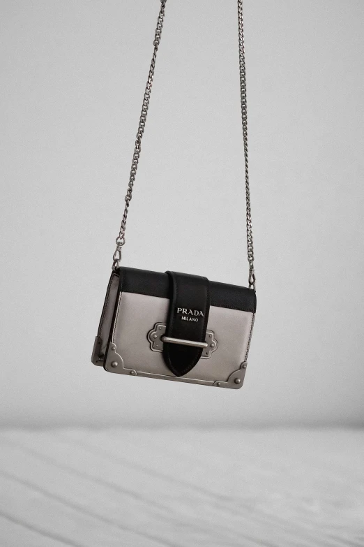 a handbag that is hanging from a chain