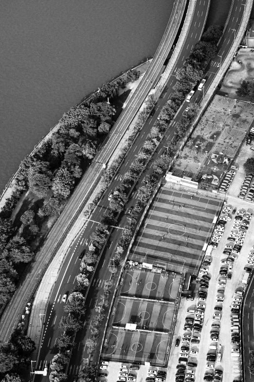 an aerial view of a freeway and parking lot in a city