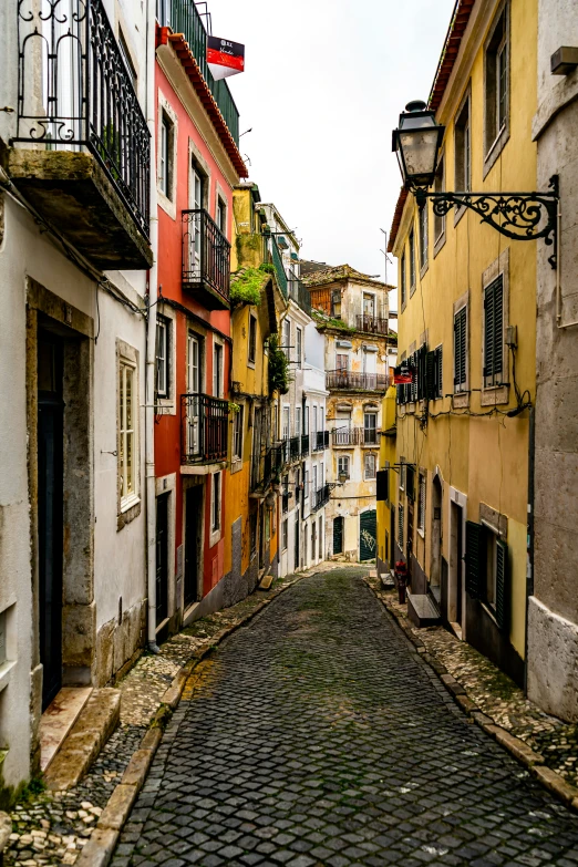 narrow street with several buildings in a foreign country