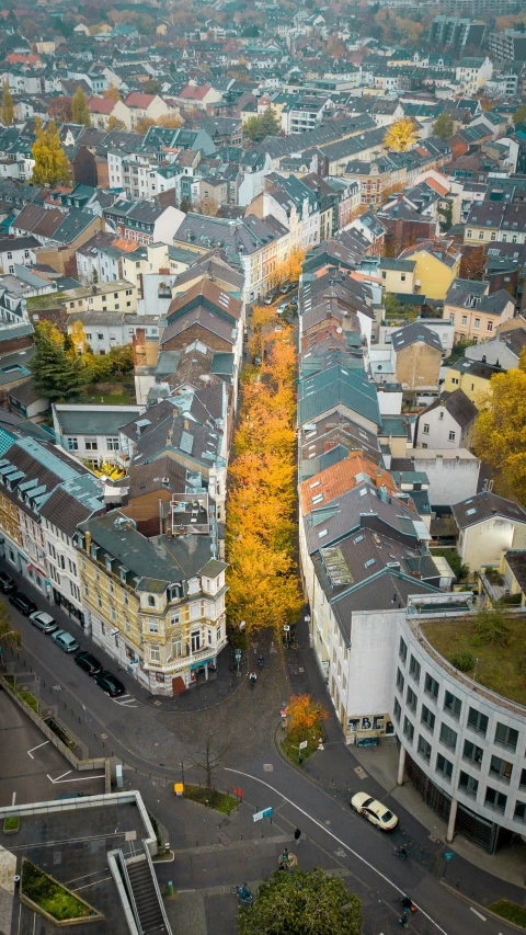 a large long block of buildings with a traffic circle