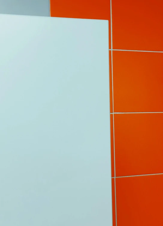 an image of a sink sitting under some tiles