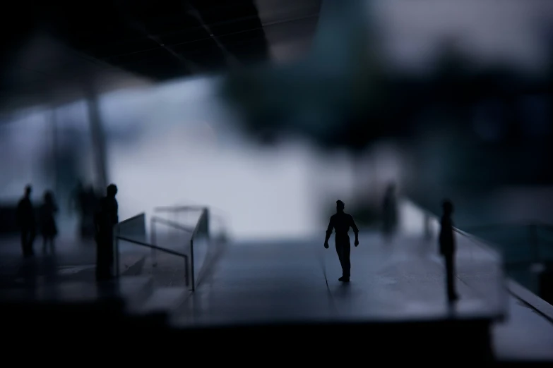 a blurry po of some figures walking on a ramp