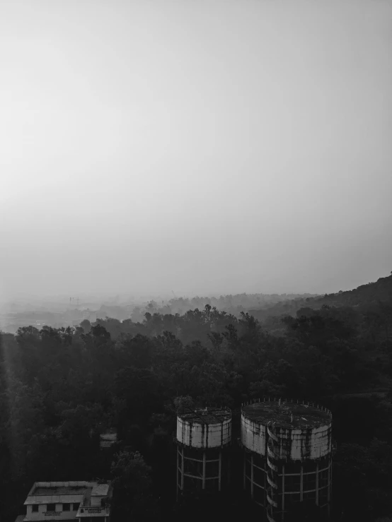 the foggy morning sky is clear and the city's landscape looks out over the hills