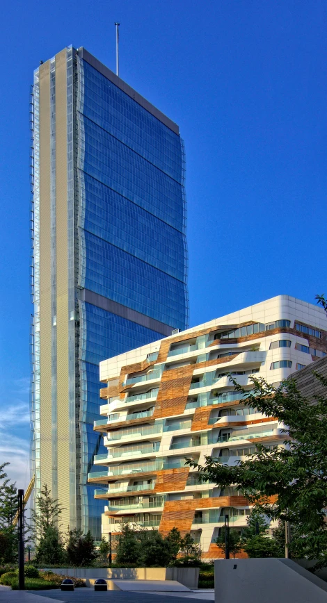 building in the foreground with trees in front