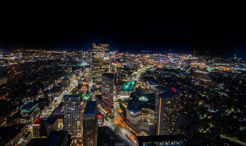 a night view of city lights from the top of a skyscr