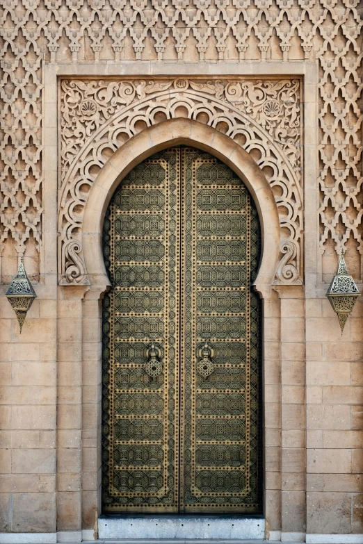 the gold door is open and it has intricate patterns