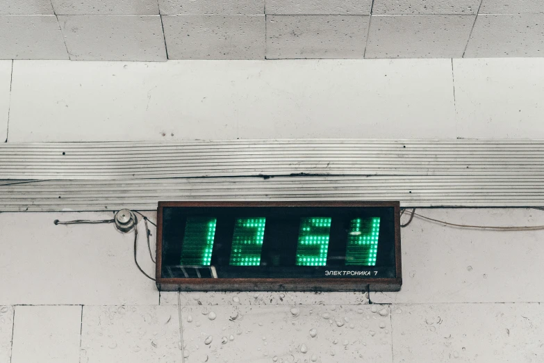 a green neon clock that says ten to six minutes remaining