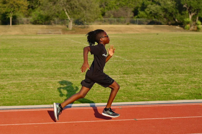 a  is running on an outside running track