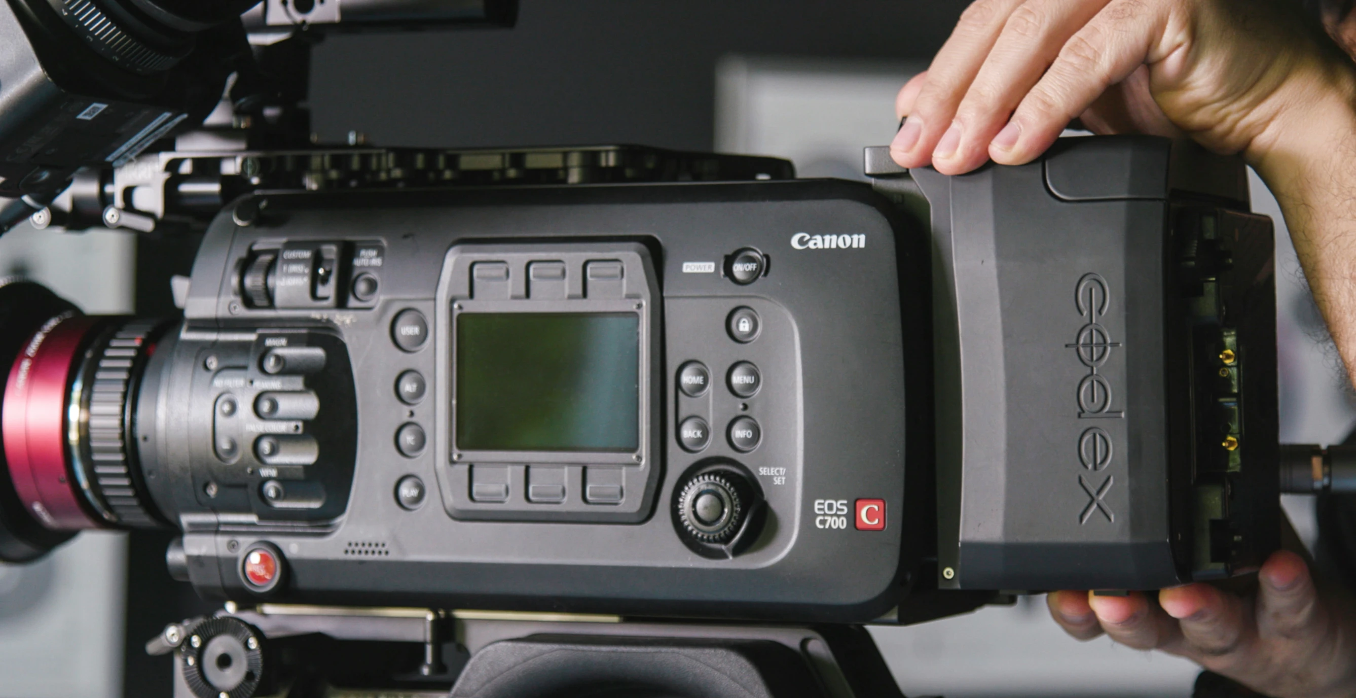 a close up of a camera being attached to a device