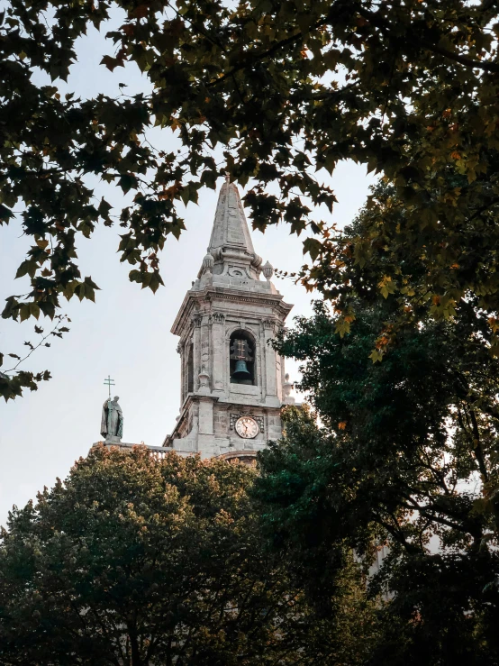 a clock is shown on the top of this building