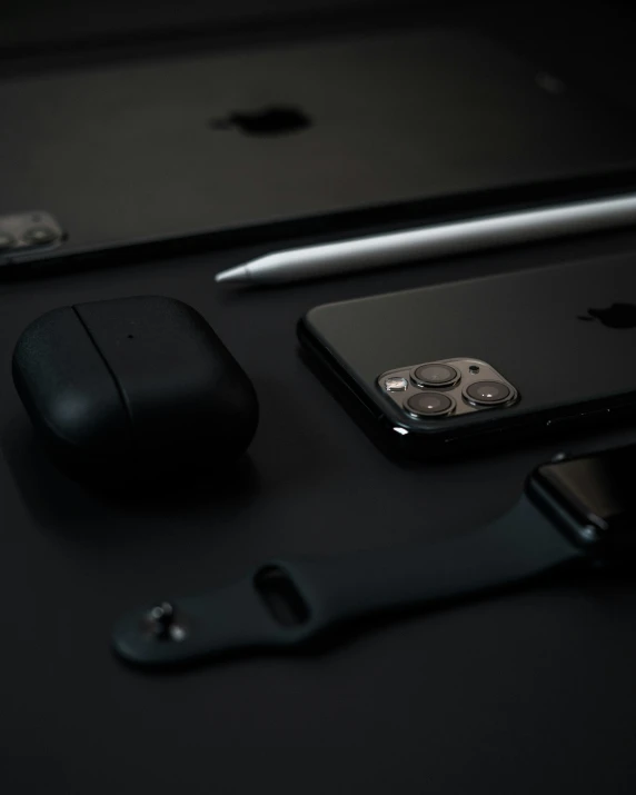 a phone, mouse, and keyboard sitting on a table