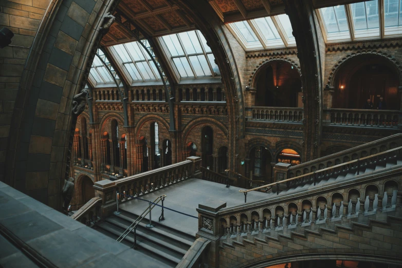 large staircase inside of a large building that has huge windows