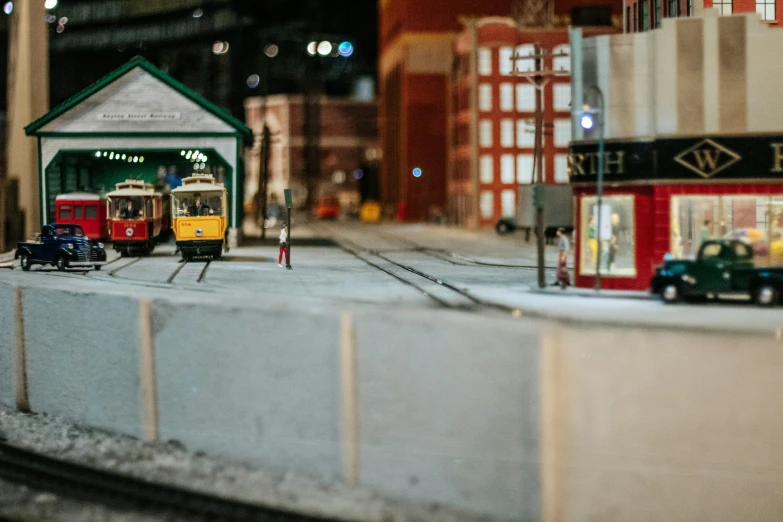 small model train set with model town and red building