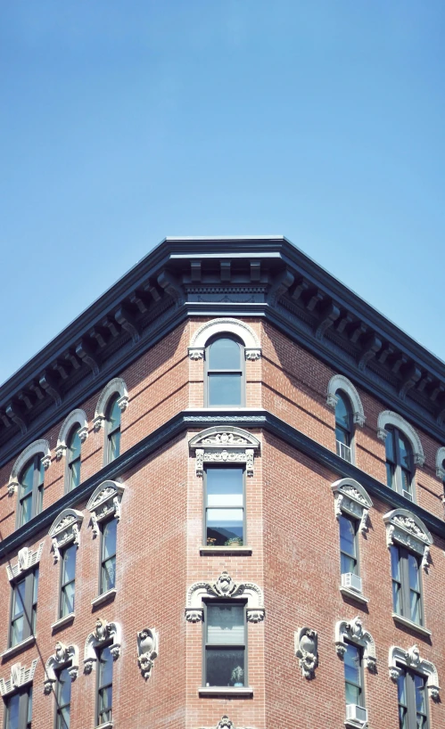 a building with the top portion of it's windows missing