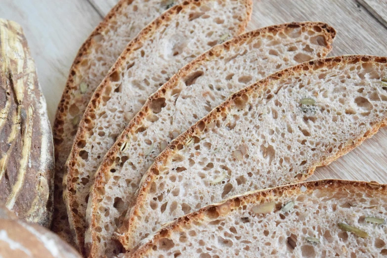 a bunch of breads that are on a white surface