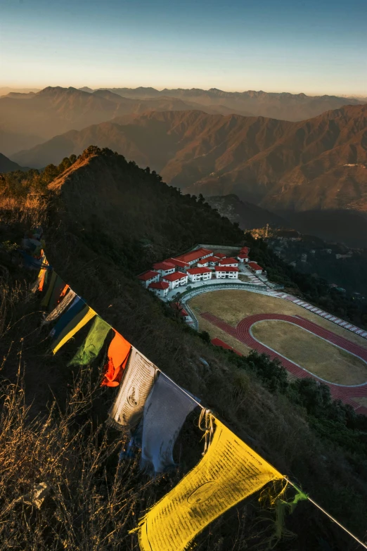 clothes hanging outside on clothes line, overlooking mountains and grass