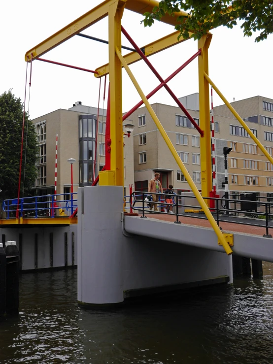 the yellow and red device is on the bridge