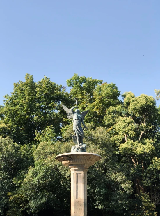 there is a statue that has an angel on it