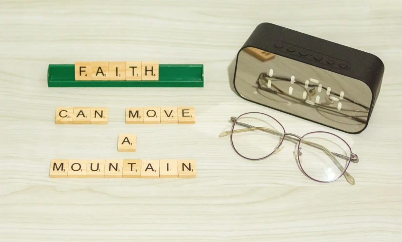 the words faith can move a mountain written in scrabble