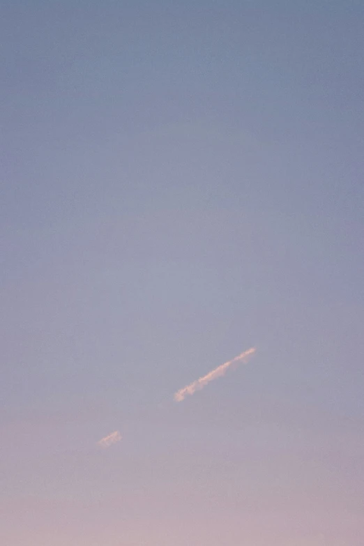 a plane in the air with no clouds in it