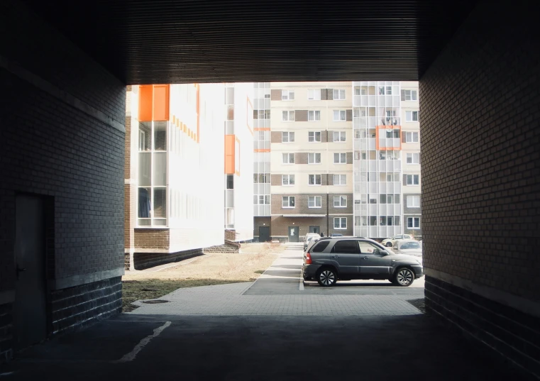 a grey car parked in an open parking lot