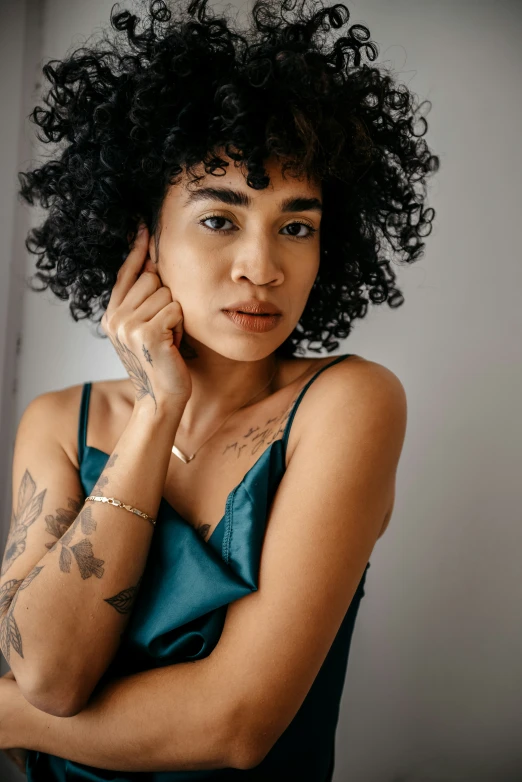 a woman is shown with her arm tattooed