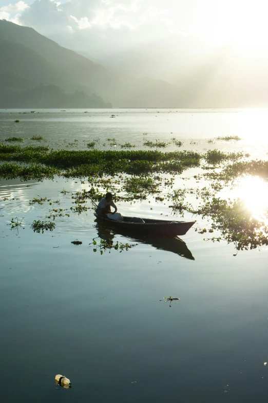 a canoe floating on top of a lake