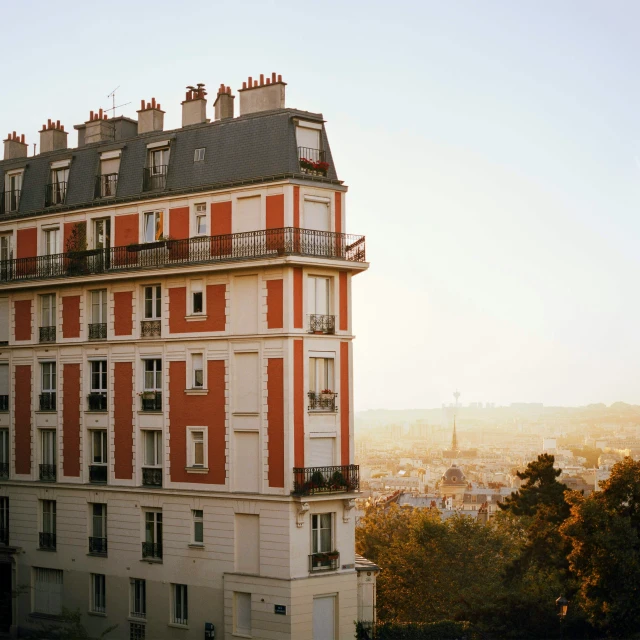 a view of an apartment building with orange shutters