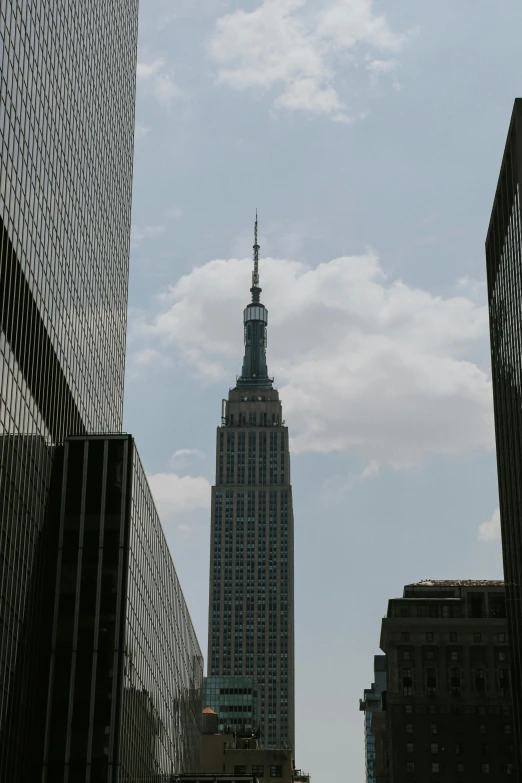 a large building standing tall next to other high rise buildings