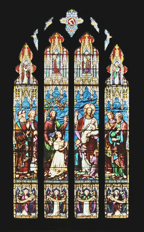 the window is decorated with colorful glass and various art