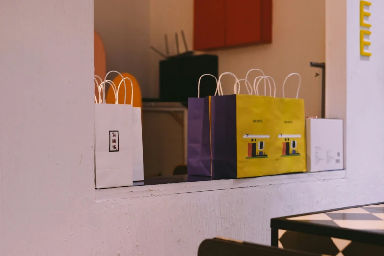 paper shopping bags stacked in front of each other