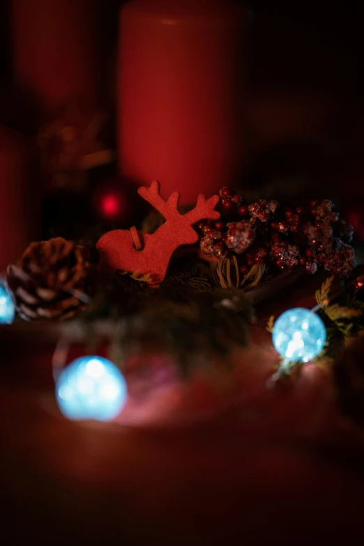 some christmas decorations that are lit up next to some lights