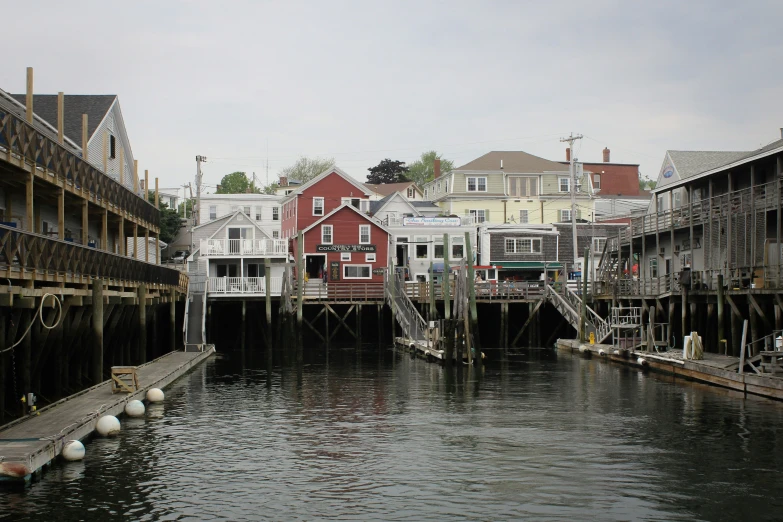 the city buildings is on stilts on the water