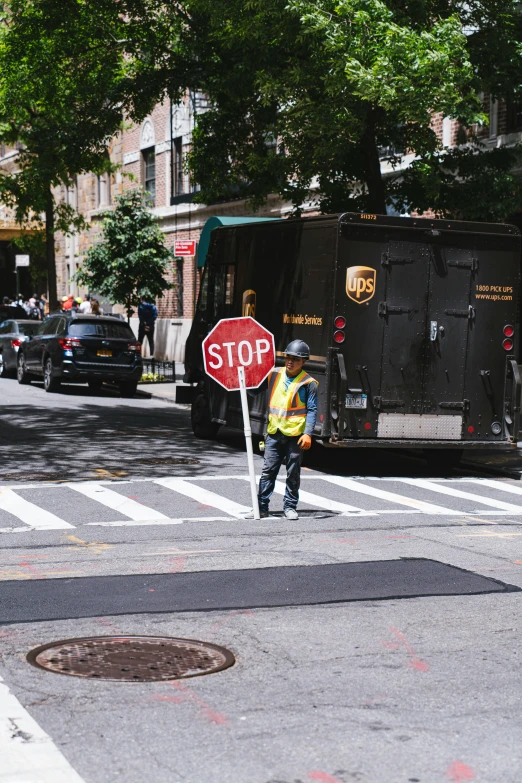 a stop sign in the street near some buildings