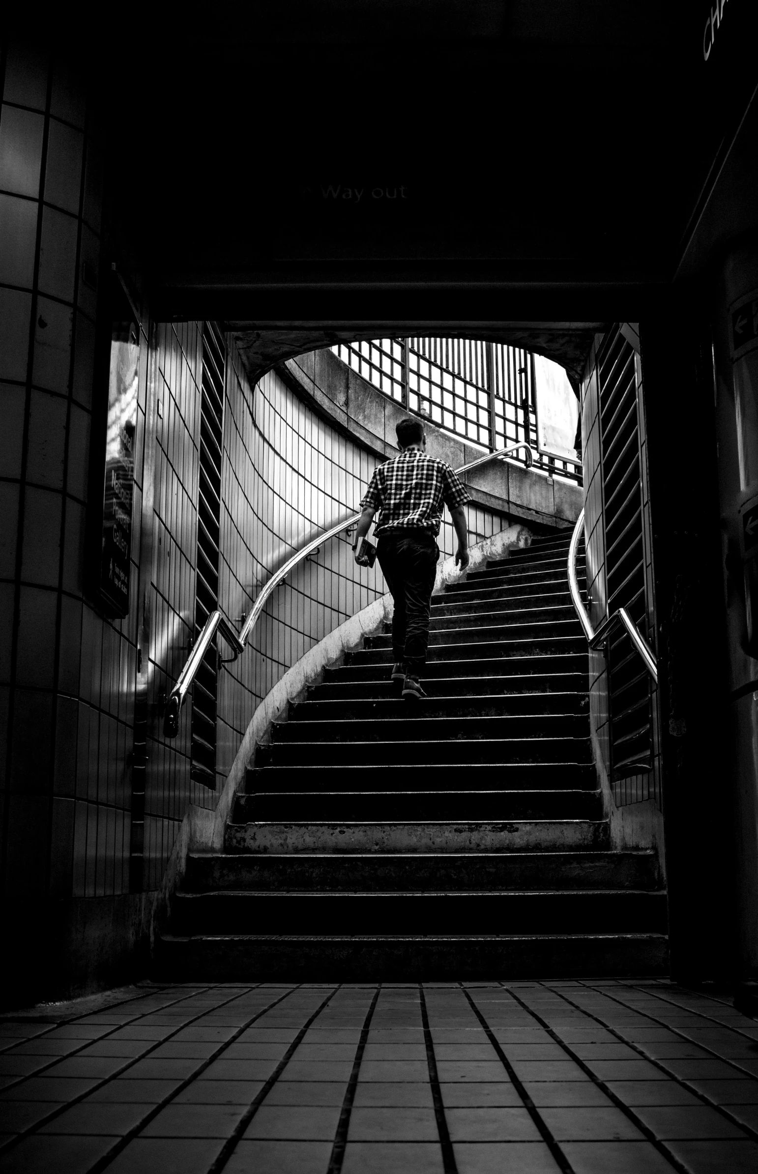 someone walking up the steps of an escalator