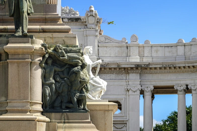 the building has statues surrounding the entry way