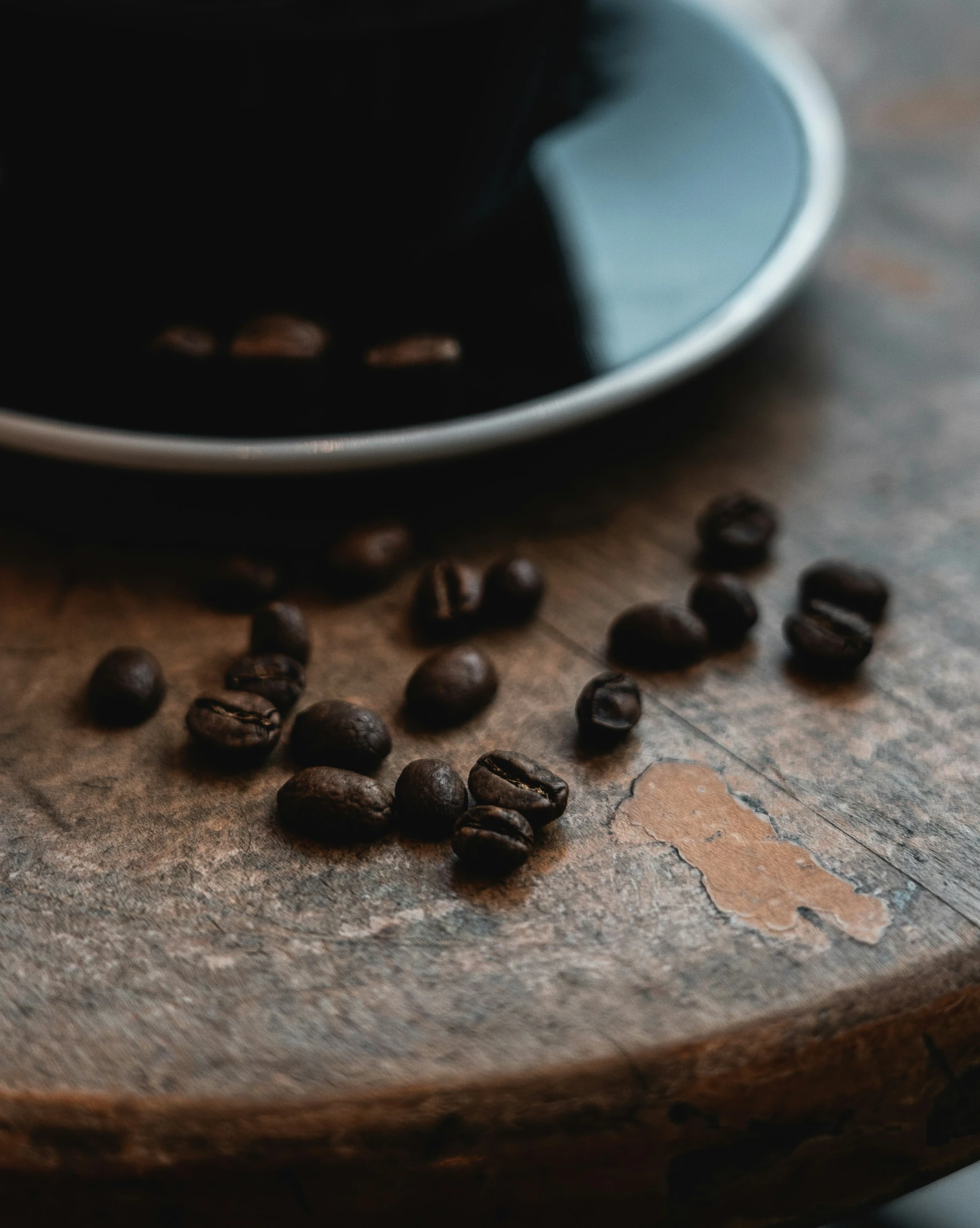 a coffee grinder filled with coffee beans on a table