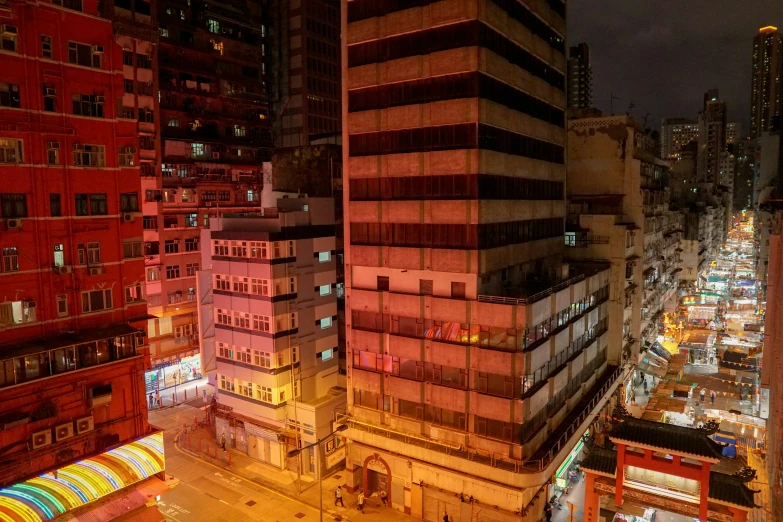 some buildings at night in an asian city