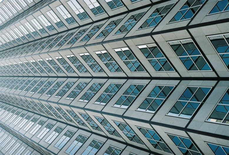 a tall building with lots of windows and bars on it